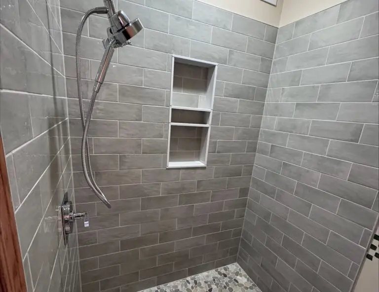 shower subway tiles and faucet