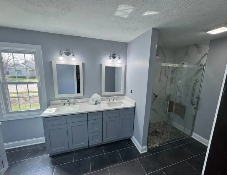 Modern bathroom with dual sinks.